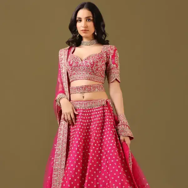 SEASONS-RANI PINK CLASSIC BRIDAL LEHENGA SET WITH ALL OVER PATTERNED HAND EMBROIDERY PAIRED WITH A MATCHING DUPATTA AND FLORAL EMBROIDERED DETAILS.