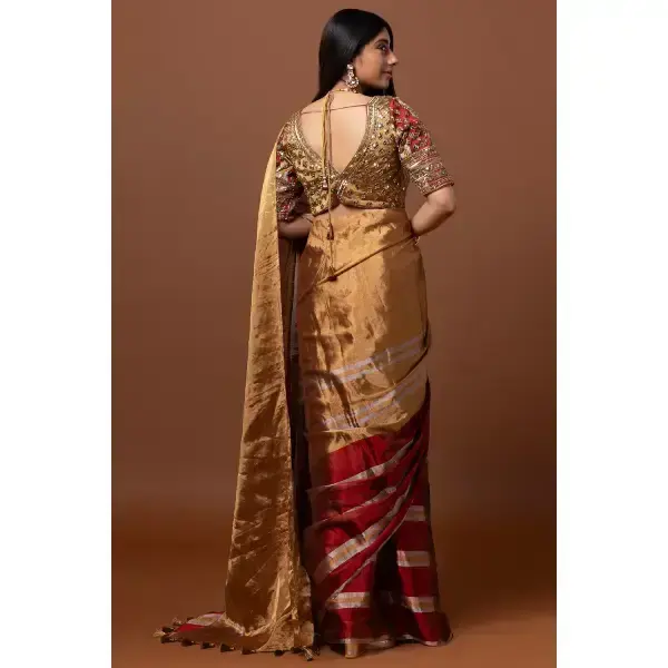 SEASONS-GOLD AND RED CLASSIC SAREE SET PAIRED WITH A MATCHING HAND EMBROIDERED BLOUSE AND MIRROR DETAILS.